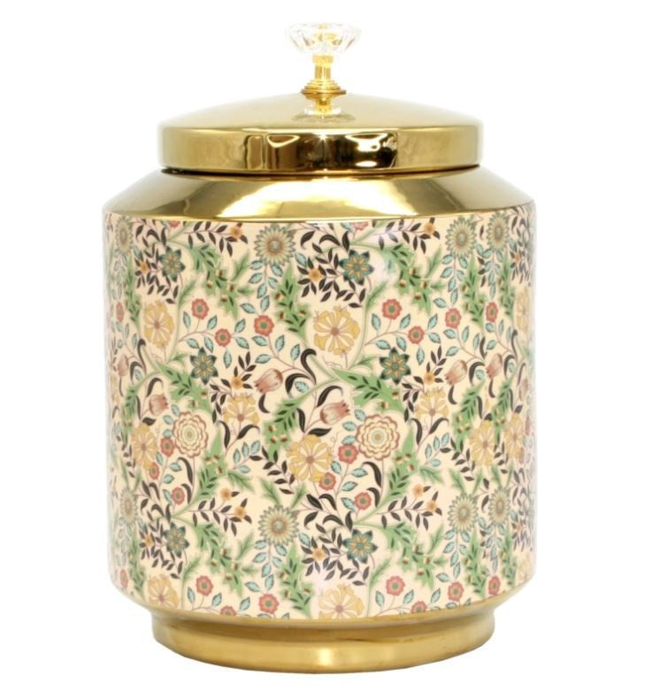 Decorative round porcelain floral canister with intricate botanical pattern, gold lid, and crystal-style finial.