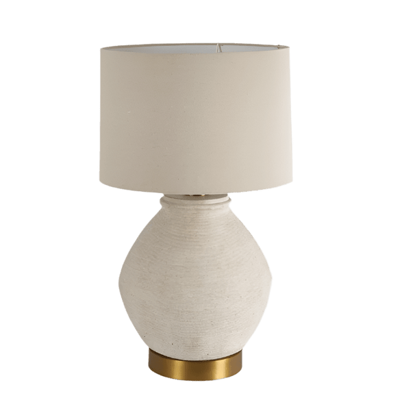 Forbes white sandstone table lamp with linen shade on a bedside table in a coastal style interior
