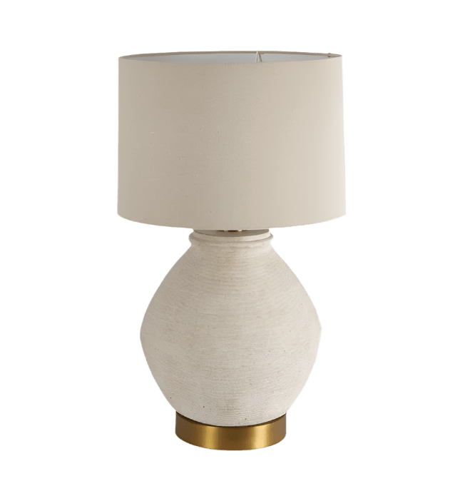 Forbes white sandstone table lamp with linen shade on a bedside table in a coastal style interior
