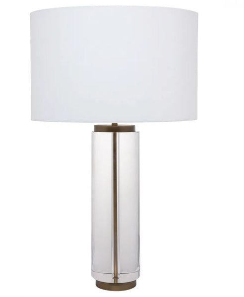 Forrester crystal table lamp featuring a solid clear crystal column, brass detailing and white linen shade.