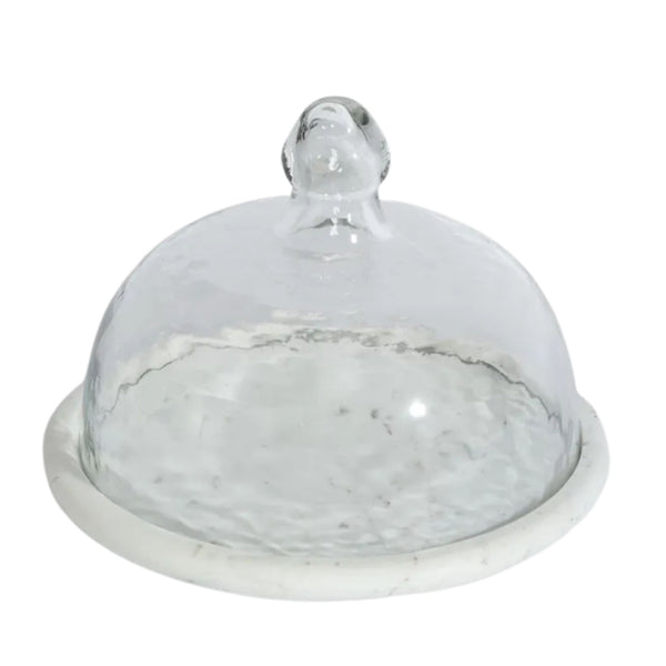 Glass cloche with white marble base on white background