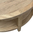 Close-up detail of the French Contemporary Round Coffee Table showing weathered oak finish and handcrafted timber construction.
