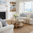 French Contemporary Round Coffee Table styled in a Hamptons-inspired living room with hydrangeas, jute rug and coastal furnishings.