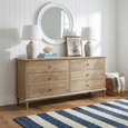 Georgia 6 Drawer Dresser styled in a Hamptons bedroom with a white porthole mirror, ceramic table lamps and coastal décor.