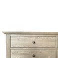 Close-up of Georgia Dresser dark oak drawer fronts and classic round knobs