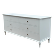 Angled view of the Georgia White 6 Drawer Dresser showcasing its turned legs, white finish and brass drawer knobs.