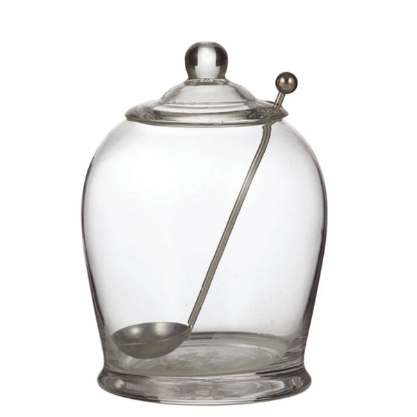 clear glass olive jar with lid and metal serving spoon, elegant condiment jar for kitchen or entertaining, perfect for olives, pickles or preserves in a refined coastal style