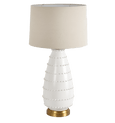 Grace white ceramic table lamp with linen shade styled in a coastal living room