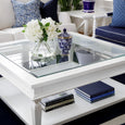 Close-up styling of Hampton Square Coffee Table with blue and white ceramics, books, and fresh hydrangeas