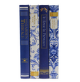 Hamptons decorative book box set of four arranged in a stack with blue and white floral covers and navy gold-detailed designs.