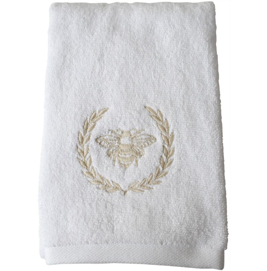 White cotton hand towel with embroidered bee and laurel wreath detail