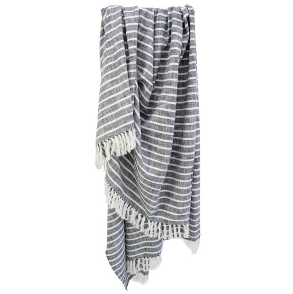 Harbour Navy striped throw blanket with soft woven texture and white fringe detailing draped for relaxed coastal bedroom or living room styling