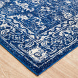 Close-up corner of the Harley Navy Rug highlighting the distressed navy and ivory border design.