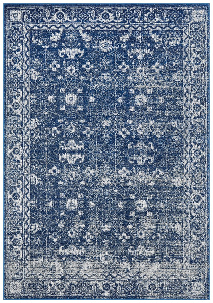Harley Navy Rug with distressed vintage Persian pattern in rich navy blue and ivory tones.
