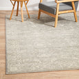 Harley Silver Rug styled in a neutral living room with grey chair and timber furniture