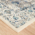 Corner detail of the Harley White Rug highlighting the distressed floral motif and soft ivory base