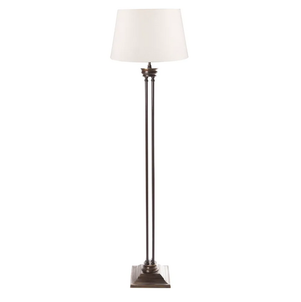 Hudson solid brass floor lamp with elegant four column frame and square base in luxury living room
