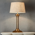 Hudson Table Lamp Base Brass with Large Dark Natural Linen Drum Lamp Shade styled on a console table, creating warm ambient lighting with timeless brass elegance.