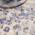 Close-up of the Hunter Ocean Round Rug showing the soft polypropylene pile and distressed blue coastal pattern.