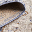 Folded edge of the Hunter Ocean Round Rug highlighting the durable bound edge and soft 10mm pile.