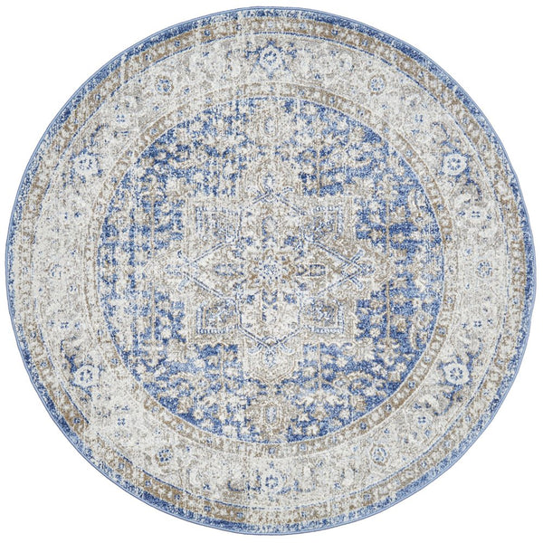 Hunter Ocean round rug featuring a distressed traditional medallion design in ocean blue, ivory and warm sand tones.