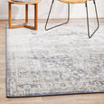 Hunter Ocean Rug styled in a relaxed coastal living space with rattan chair and natural timber accents