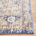 Close-up detail of the Hunter Ocean Rug showing distressed blue border and textured transitional pattern