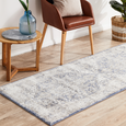 Hunter Ocean runner rug styled in a Hamptons-inspired interior with a leather chair and timber side table.