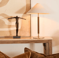 Luxury Huntley brass table lamp with neutral linen shade in contemporary living room