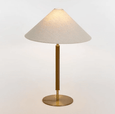 Close-up of Huntley table lamp featuring brushed warm brass finish and leather-look wrap