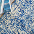 Close-up of Isla Navy and White Runner showing distressed traditional medallion pattern