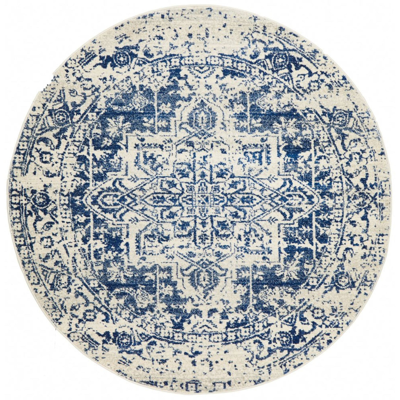 Isla White Navy Round Rug with distressed navy medallion pattern on warm white