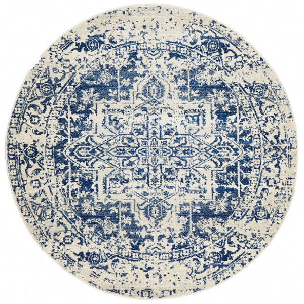 Isla White Navy Round Rug with distressed navy medallion pattern on warm white