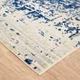 Close-up corner detail of Isla White Navy Rug with distressed ivory and navy design