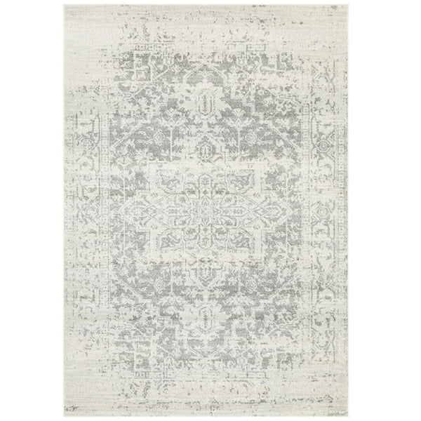 Isla White Silver Rug featuring a distressed floral design in soft ivory and silver-grey tones