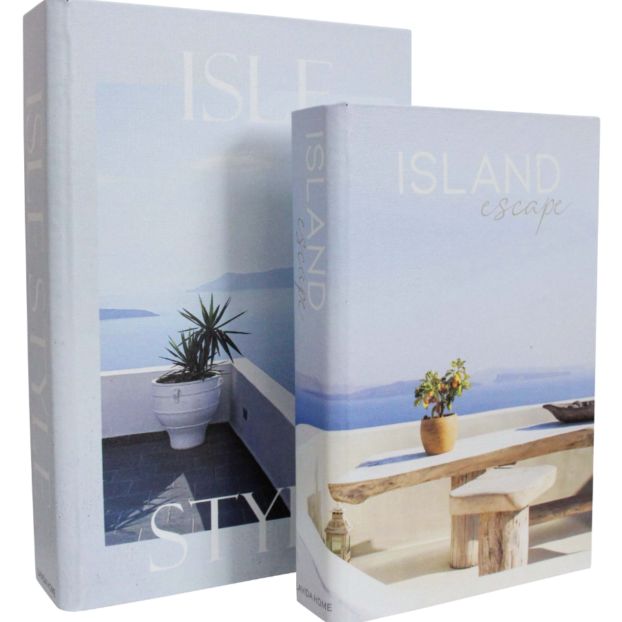 Island Escape Decorative Book Box Set of 2 featuring Isle Style and Island Escape coastal designs in soft blue and white with Mediterranean seaside photography.