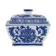Blue and white Ming-inspired ceramic trinket jar with lid featuring an intricate floral motif and traditional porcelain styling.