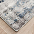 Close-up corner detail of the Keira Grey Runner showing textured high-low pile and soft coastal tones