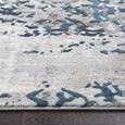 Detailed texture view of the Keira Grey Runner with abstract distressed blue and grey pattern