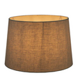 Large ivory linen drum lamp shade illuminated to create a warm ambient glow in a Hamptons-style home.