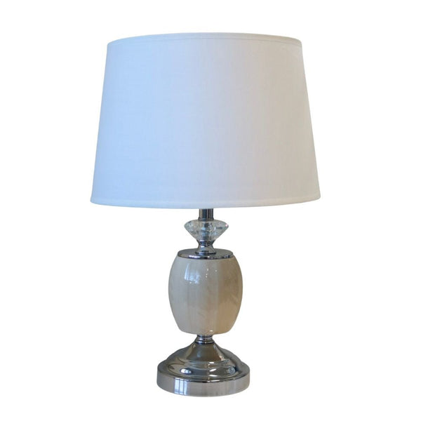 Lauren crystal accent table lamp with metallic finish styled on bedside table
