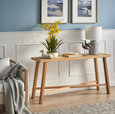 blue and white table lamp styled on timber console in coastal living room setting