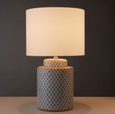 blue and white table lamp illuminated with warm ambient light