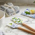 Lemon Spatula Set styled on a marble kitchen benchtop alongside lemons, baking ingredients, tea towels, and French-country kitchen accessories.