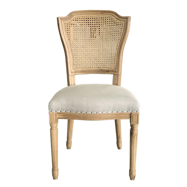 Lilian Rattan Dining Chair in weathered solid oak with woven rattan back and oatmeal linen upholstered seat.
