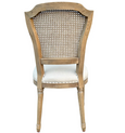 Rear view of Lilian Rattan Dining Chair showing woven cane back, weathered oak frame and oatmeal linen seat.
