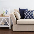 Linen Navy Cushion layered with navy and white patterned cushions on a neutral sofa in a coastal living room