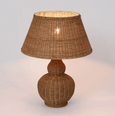 Coastal bedside styling featuring the Long Island rattan table lamp with soft ambient glow