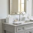Maeve Ceramic Tissue Box Cover in white ceramic styled on a marble bathroom vanity with polished nickel tapware and Hamptons-inspired décor