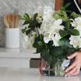 Mara marble utensil holder styled with white hydrangeas and wooden utensils in a Hamptons style kitchen interior